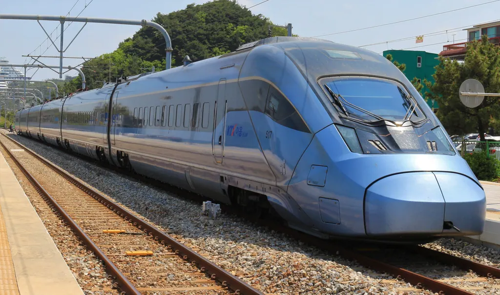 A light blue KTX-Eum high-speed train at Jeongdongjin Station on the east coast near Gangneung