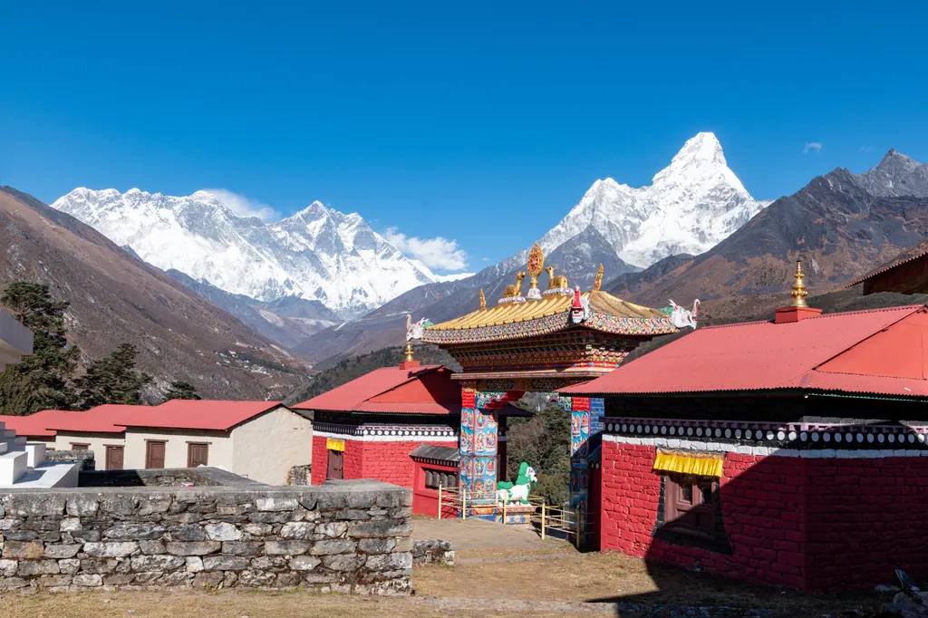 Tengboche Monastery under a clear blue sky with Everest, Lhotse and Ama Dablam behind