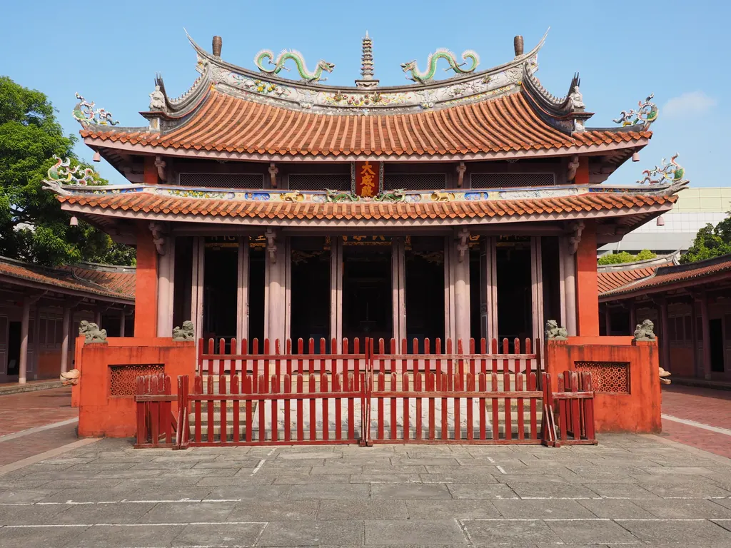 The red walls and curved roof of the Tainan Confucius Temple