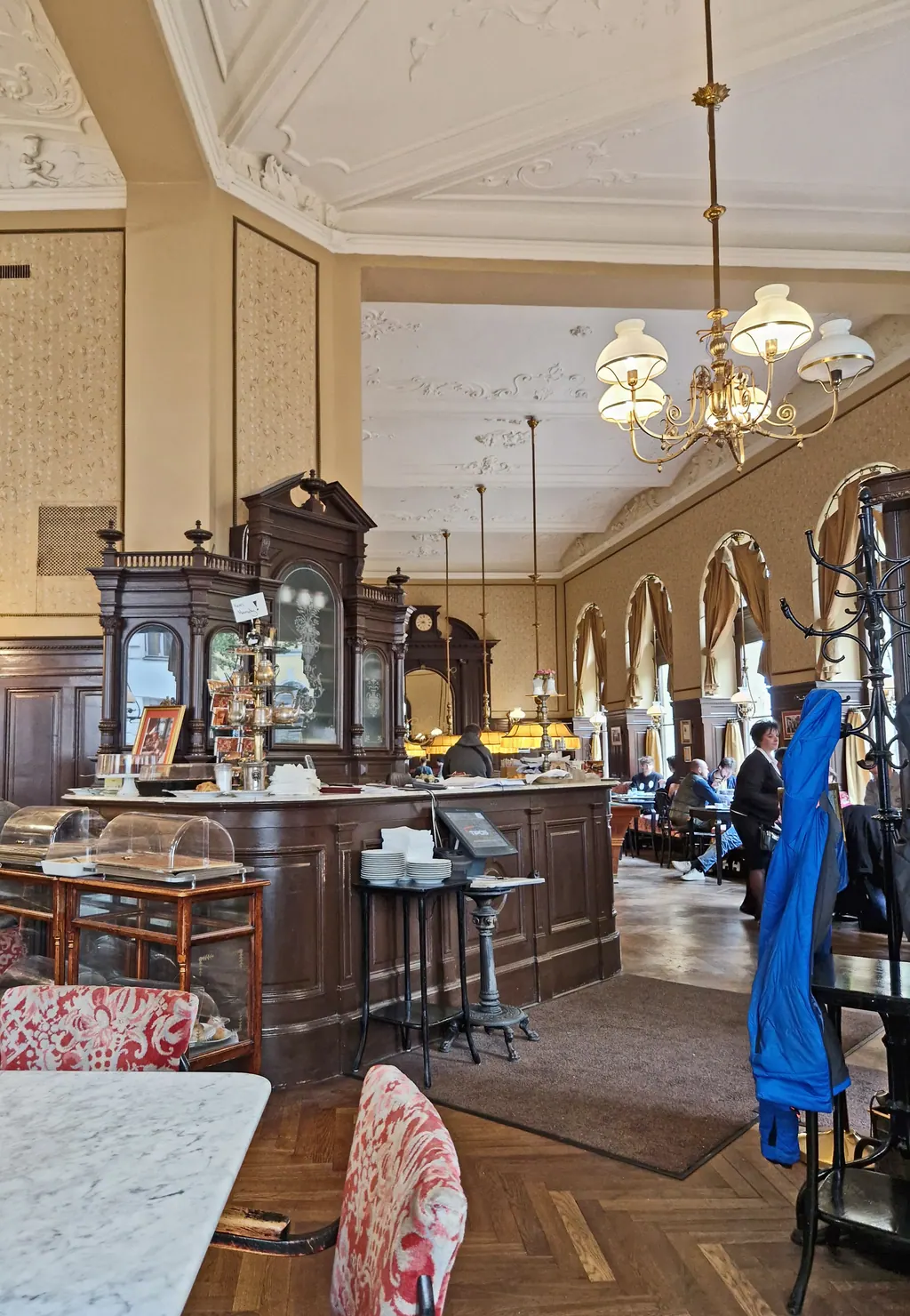 The interior of Café Sperl in Vienna, with billiard tables, newspaper racks and brass lamps