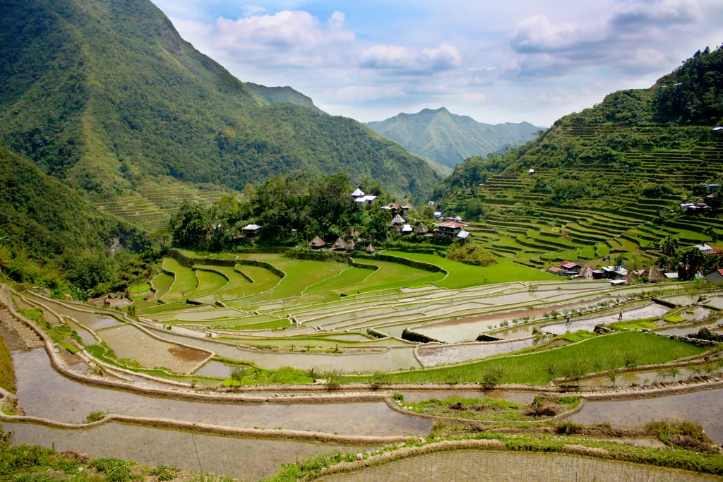The amphitheater of rice terraces around Batad village in Ifugao, with green mountains behind