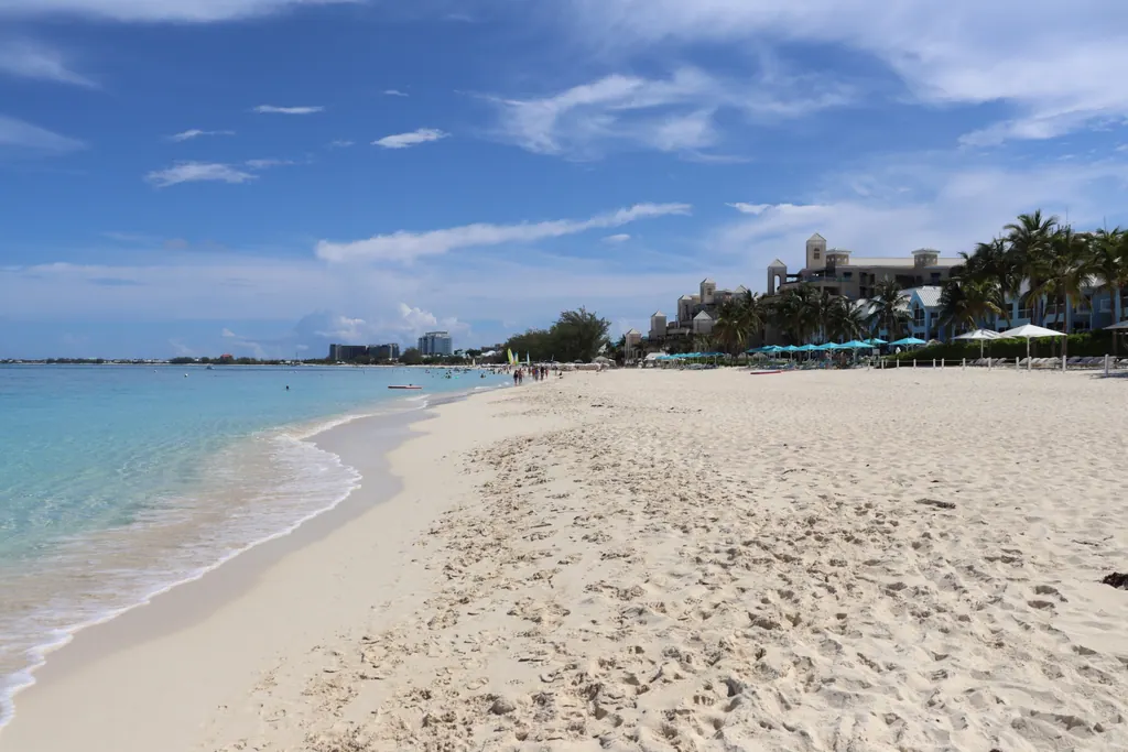 Seven Mile Beach on Grand Cayman with calm turquoise water and resorts behind the sand