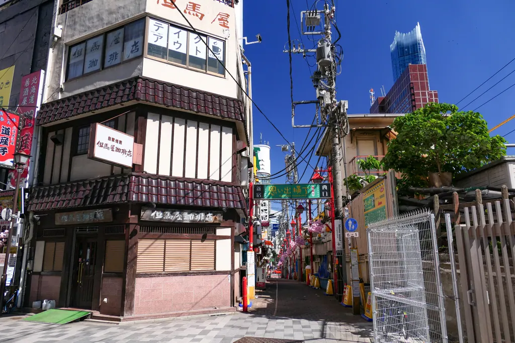 A quiet street at the entrance to Omoide Yokocho in Shinjuku, Tokyo, on a sunny day
