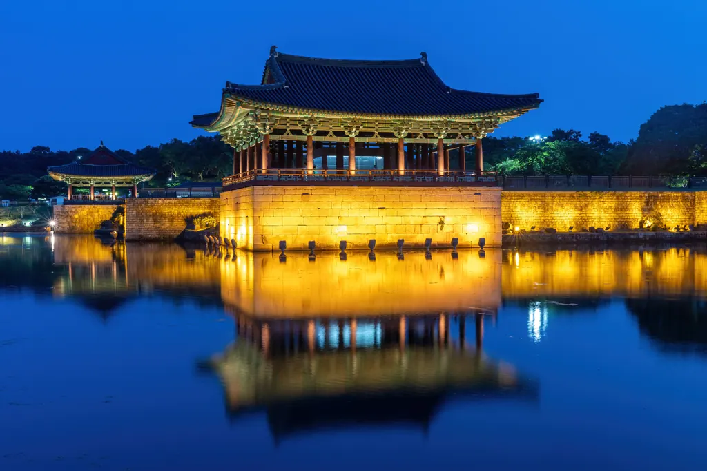 Donggung Palace pavilion reflected in Wolji Pond at blue hour in Gyeongju