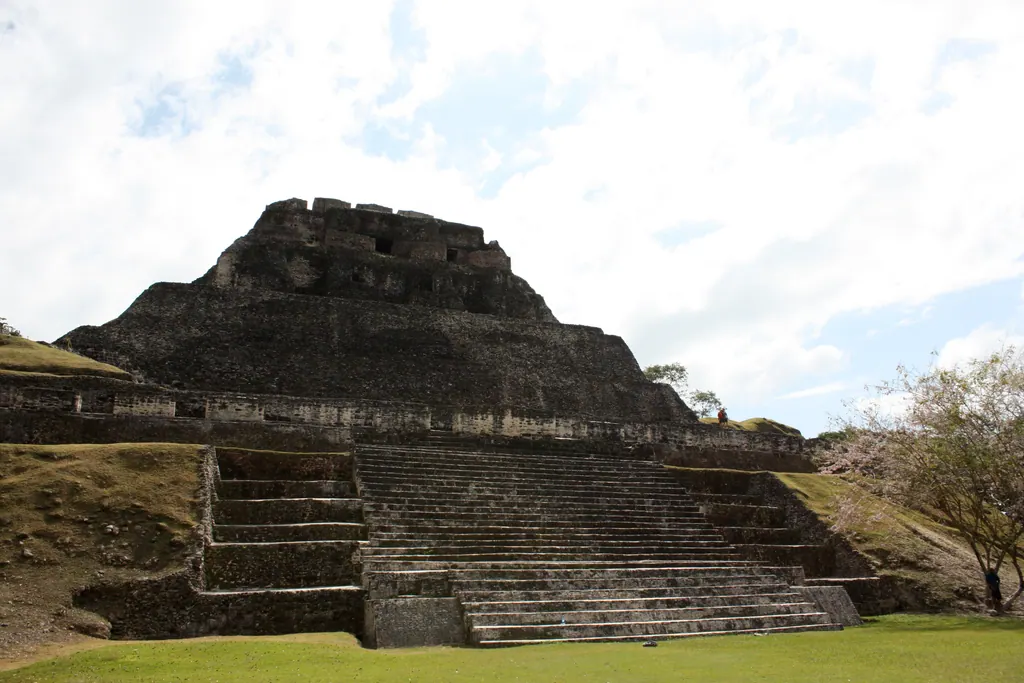 The stepped stone pyramid El Castillo at Xunantunich in Belize under a bright sky