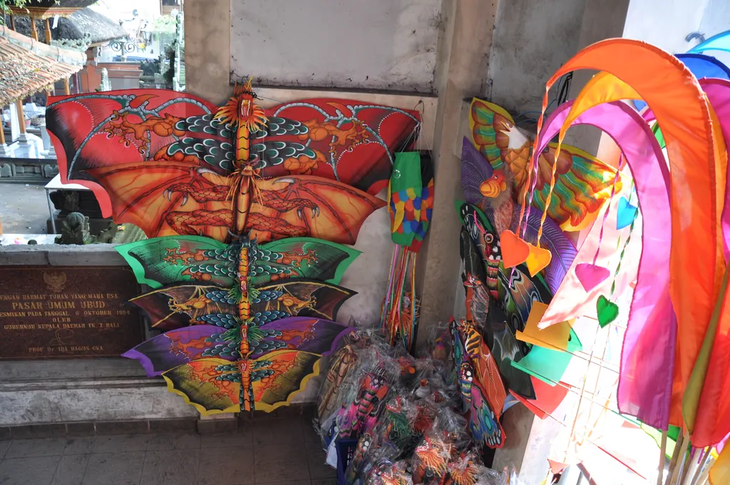 Colorful kites and banners for sale outside the Ubud market